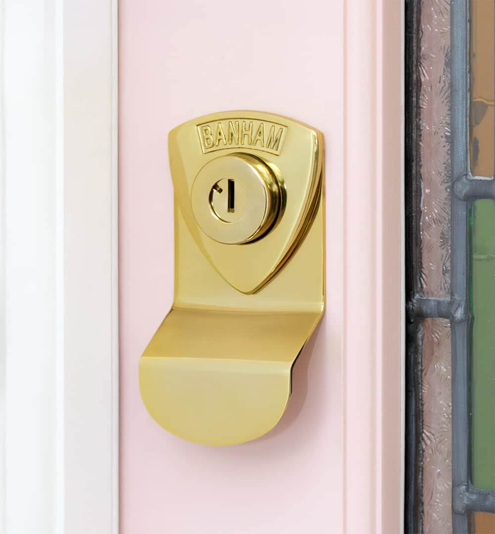 Banham lock on pink door (polished brass)